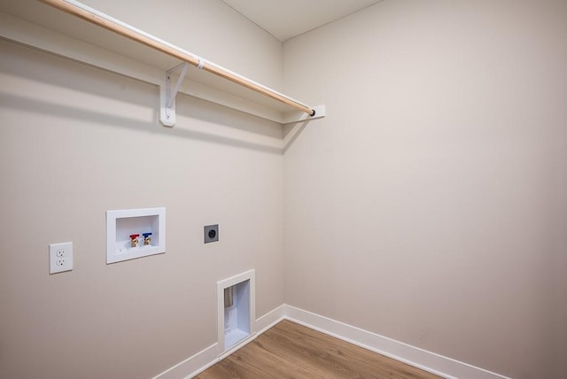 laundry room featuring hookup for an electric dryer, hardwood / wood-style flooring, and hookup for a washing machine