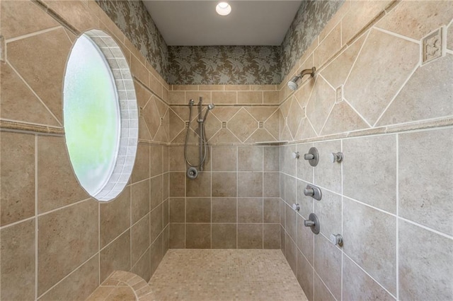 bathroom featuring a tile shower