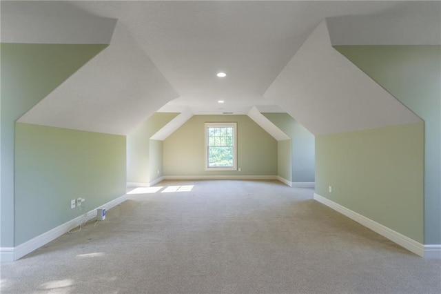 bonus room with carpet floors, baseboards, vaulted ceiling, and recessed lighting