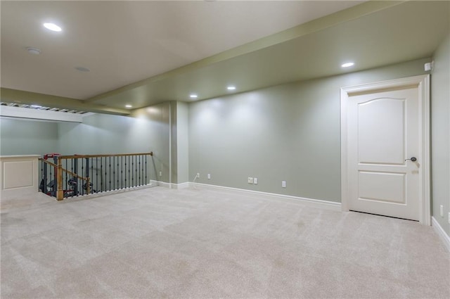 finished below grade area featuring baseboards, carpet, and recessed lighting