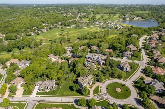 birds eye view of property with a water view and a residential view