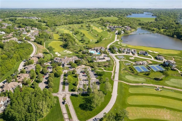 bird's eye view with a water view, a view of trees, and golf course view