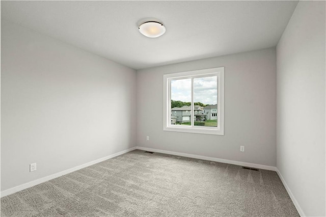 unfurnished room featuring carpet flooring