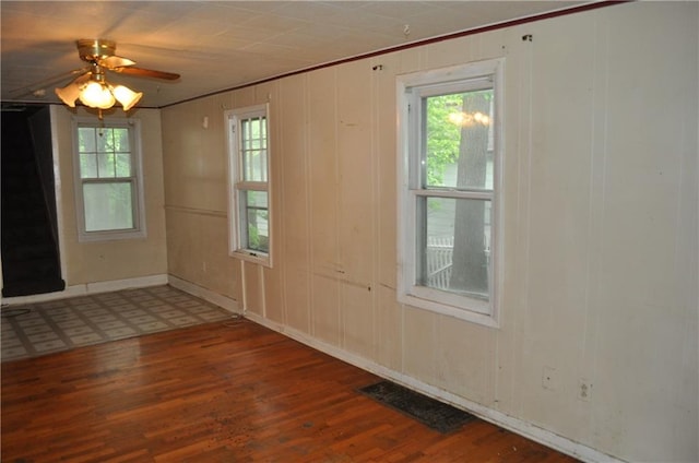 tiled empty room with ceiling fan