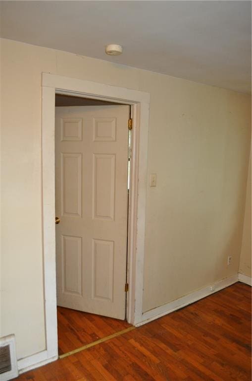 empty room featuring wood-type flooring