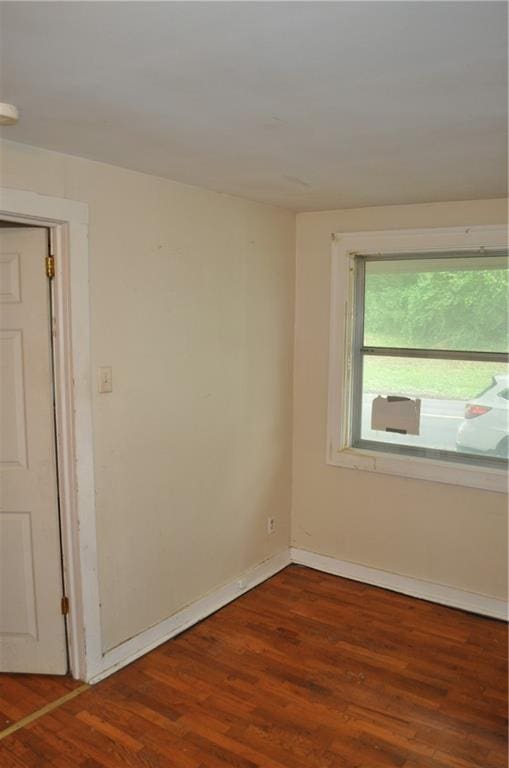 unfurnished room featuring hardwood / wood-style flooring