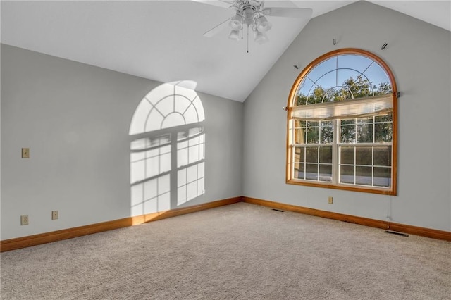 carpeted spare room with lofted ceiling and ceiling fan