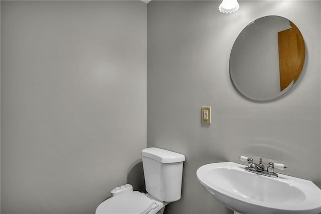 bathroom with sink and toilet