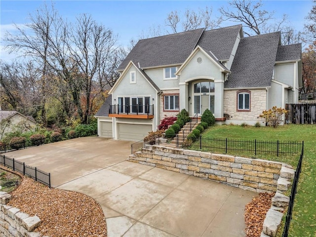 view of front facade with a garage and a front lawn