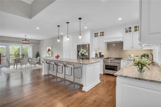 kitchen featuring white cabinets, a kitchen island, and stainless steel appliances