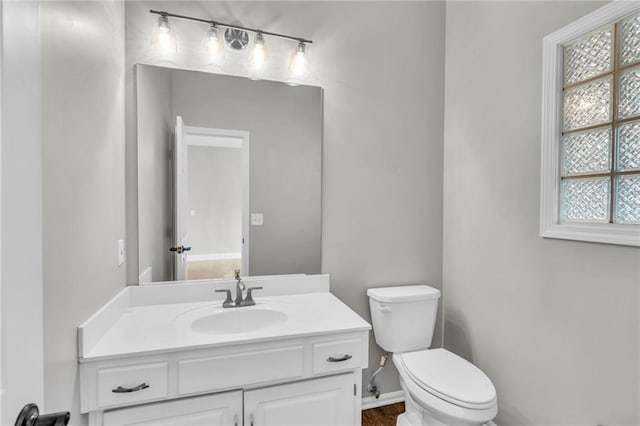 bathroom with vanity and toilet