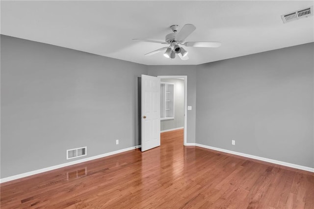 spare room with ceiling fan and light hardwood / wood-style flooring