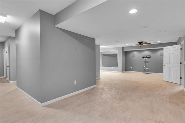 basement with ceiling fan