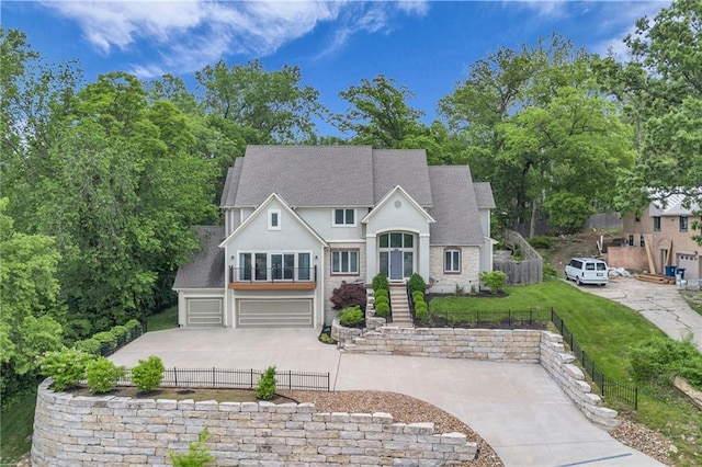 view of front of house featuring a front yard and a garage