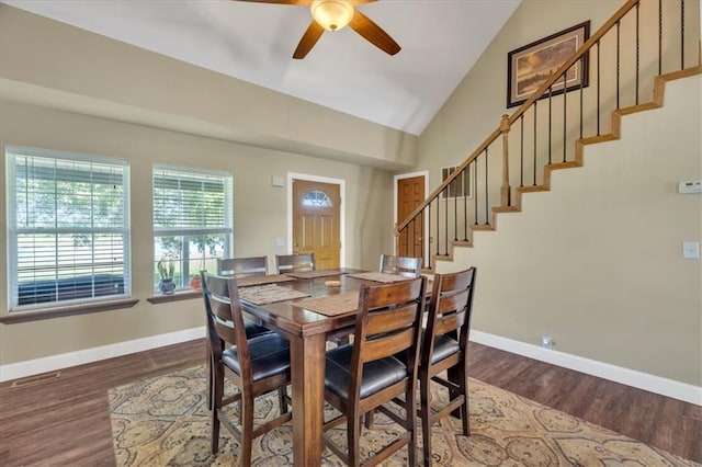 dining space featuring wood-type flooring, vaulted ceiling, and ceiling fan