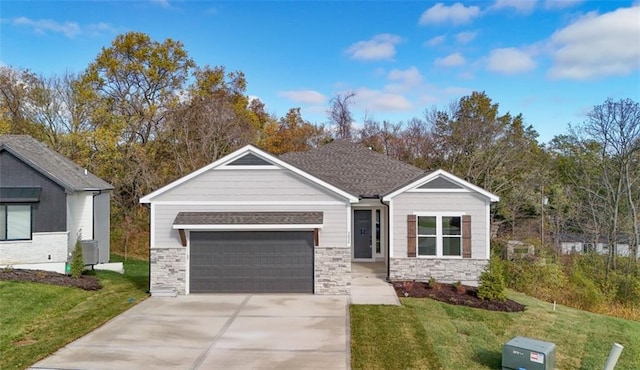 view of front of home featuring a garage and a front lawn