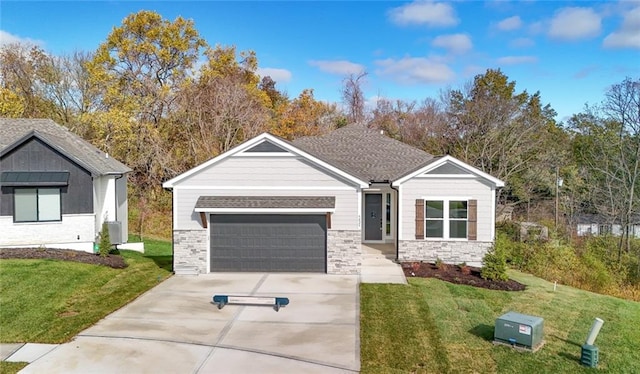 view of front of home featuring a garage and a front yard