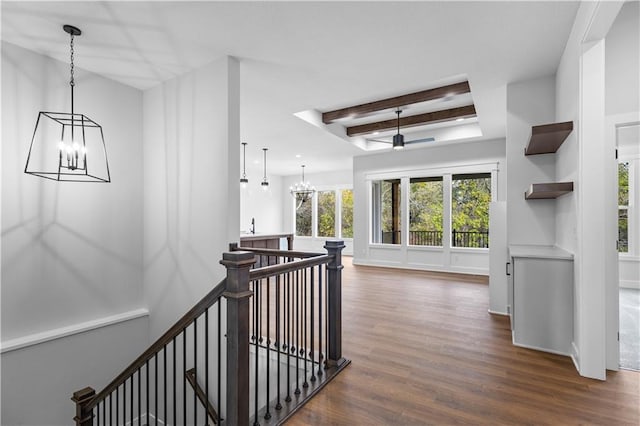 hall featuring dark hardwood / wood-style flooring, a notable chandelier, and beamed ceiling