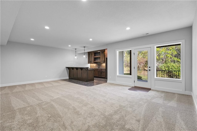 unfurnished living room with carpet