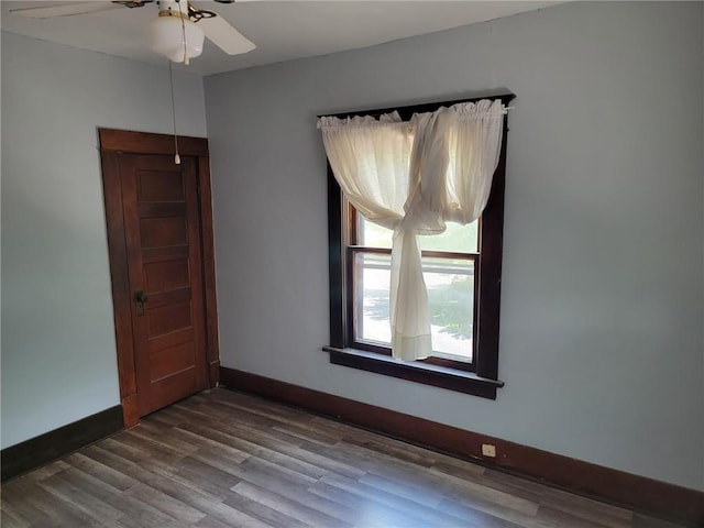 unfurnished room with ceiling fan and hardwood / wood-style flooring