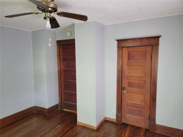 spare room featuring ornamental molding, dark hardwood / wood-style floors, and ceiling fan