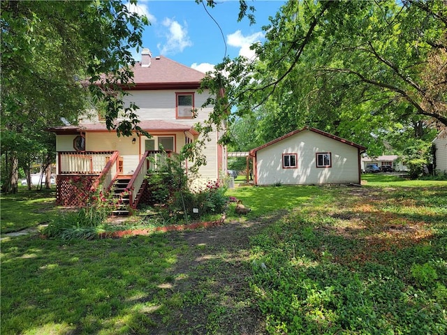 back of property with a lawn and a deck