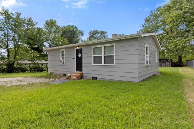 view of front of home with entry steps, driveway, crawl space, fence, and a front lawn