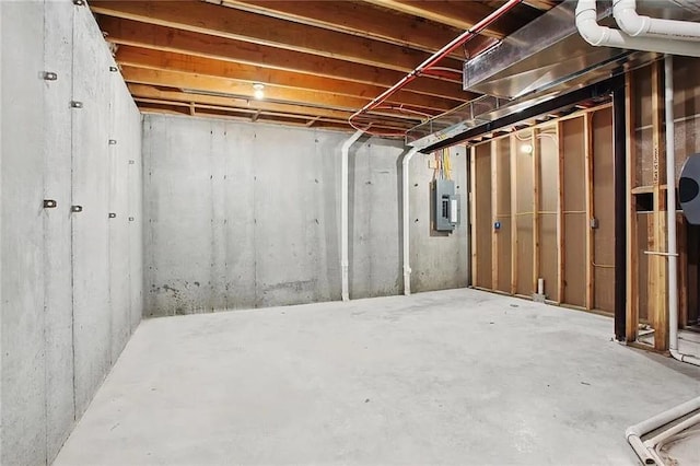 basement featuring electric panel