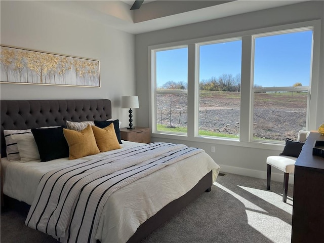 bedroom featuring multiple windows and carpet floors