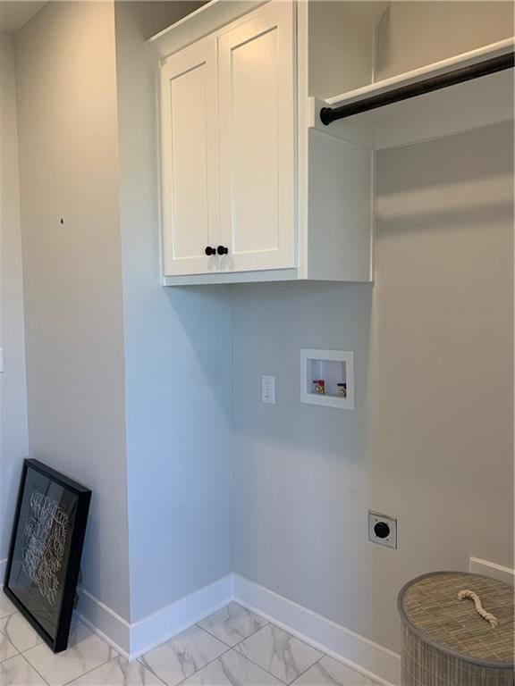 laundry area with cabinets, electric dryer hookup, and hookup for a washing machine