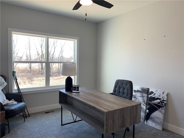 carpeted home office with ceiling fan