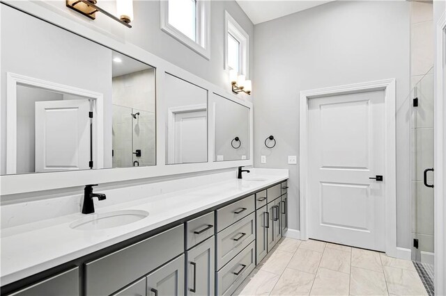 bathroom with vanity and walk in shower