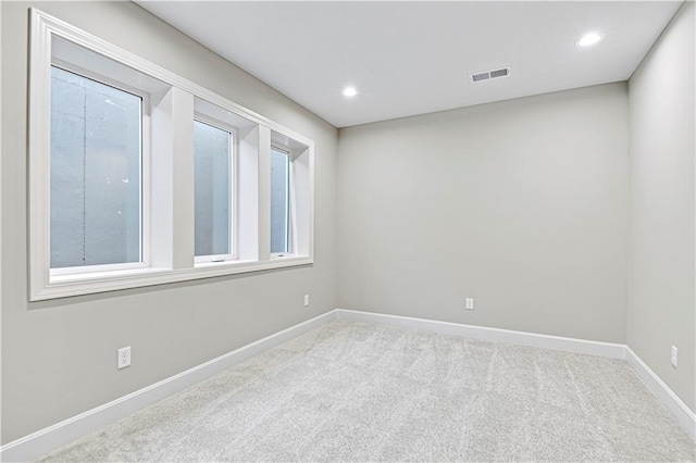 spare room with light colored carpet