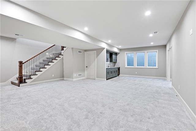 unfurnished living room with carpet flooring