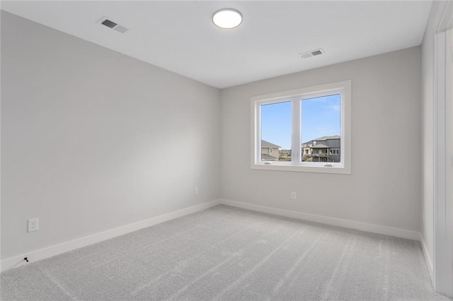 unfurnished room featuring carpet floors