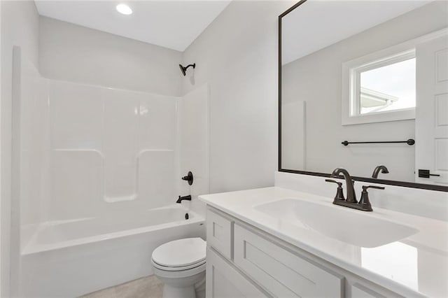 full bathroom featuring vanity, toilet, and bathtub / shower combination