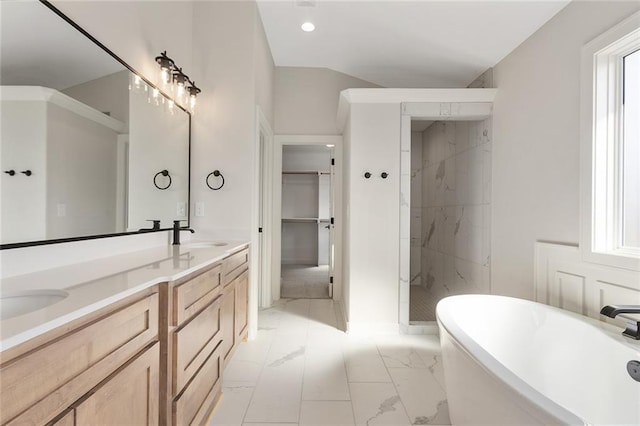 bathroom featuring a wealth of natural light, vanity, and separate shower and tub