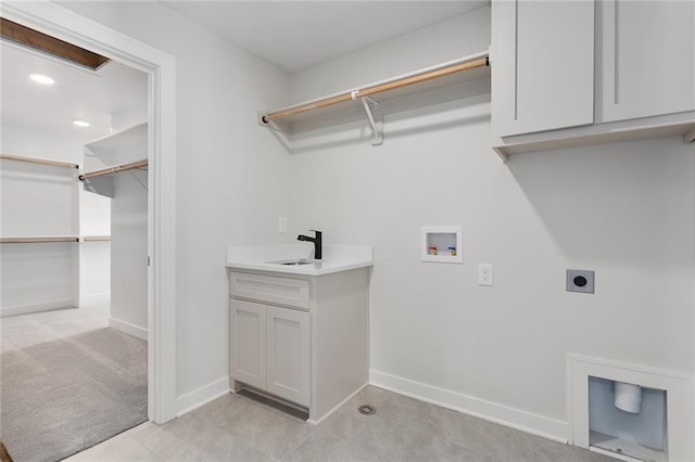 laundry room featuring hookup for an electric dryer, light colored carpet, cabinets, sink, and hookup for a washing machine