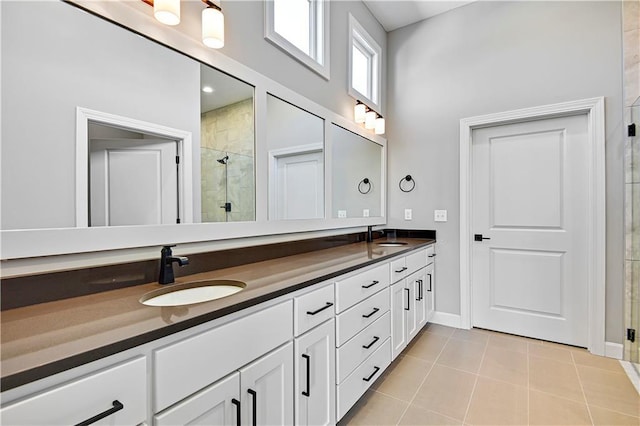 22047 W 94th St, Lenexa, KS 66220 - bathroom featuring a stall shower, double vanity, and tile patterned floors