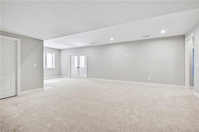 22047 W 94th St, Lenexa, KS 66220 - spare room featuring light colored carpet, recessed lighting, and a textured ceiling