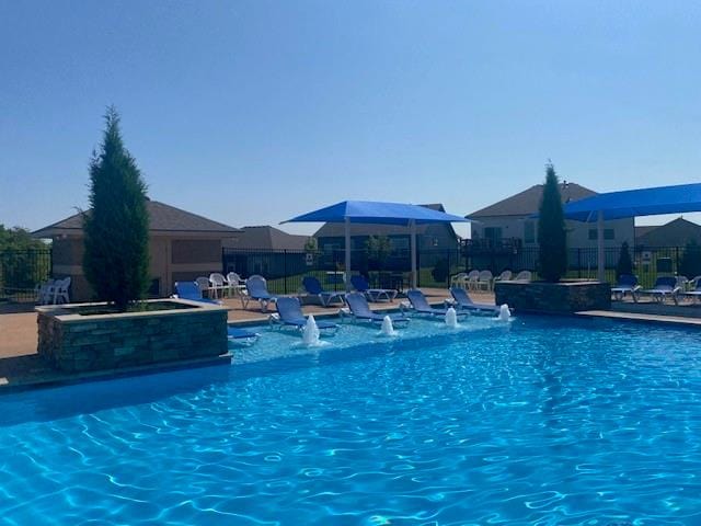 view of pool featuring pool water feature