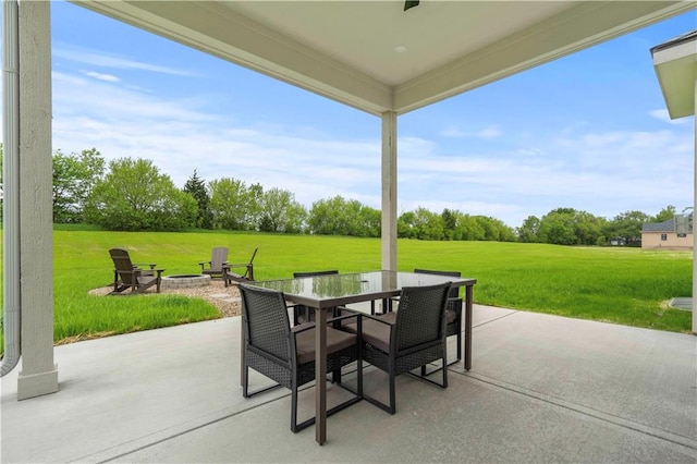 view of patio / terrace featuring a fire pit