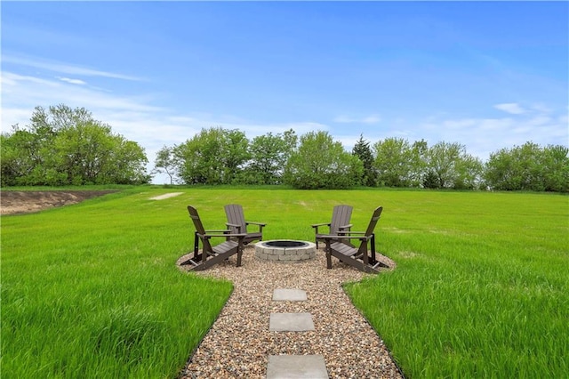 view of yard featuring an outdoor fire pit