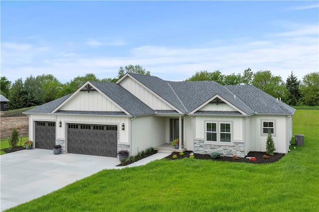 view of front of property with a front yard and a garage