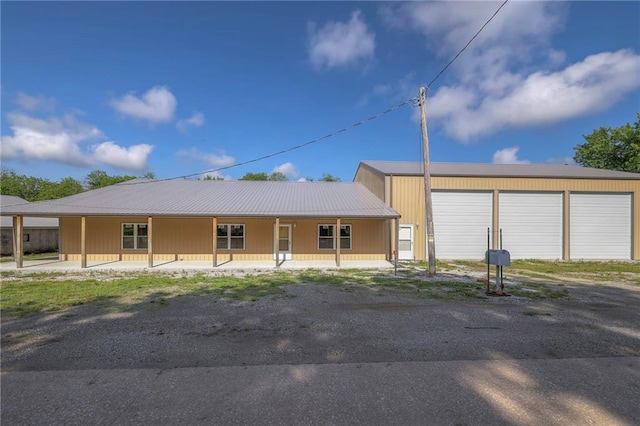 view of front of property with a garage and a porch