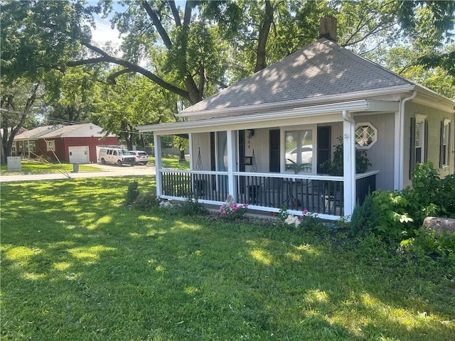 view of front facade with covered porch and a front yard