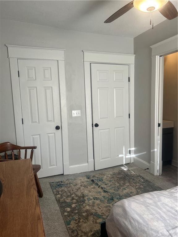 carpeted bedroom with ceiling fan