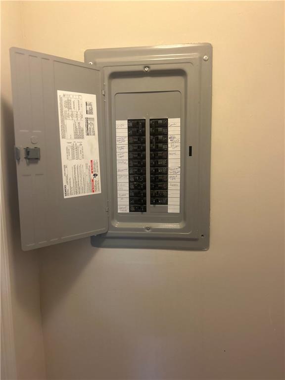 utility room featuring electric panel