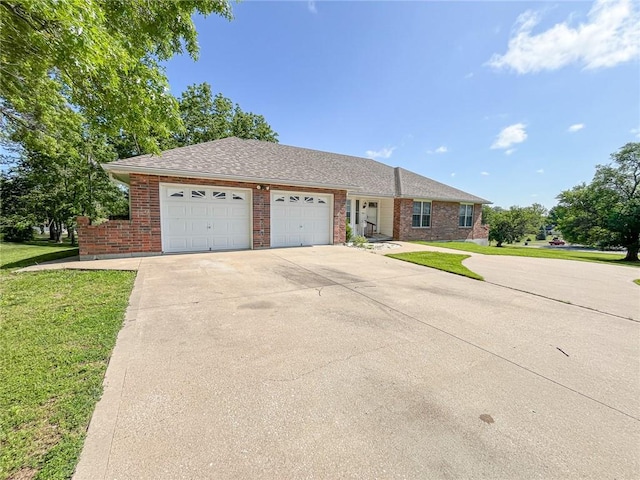 ranch-style house with a garage and a front yard