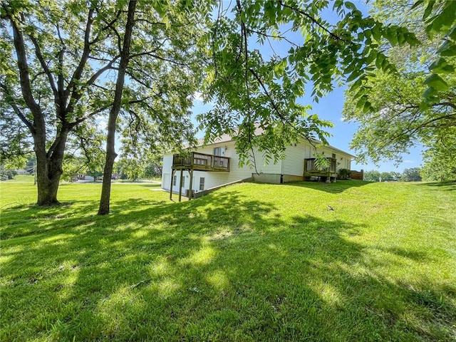 view of yard featuring a wooden deck